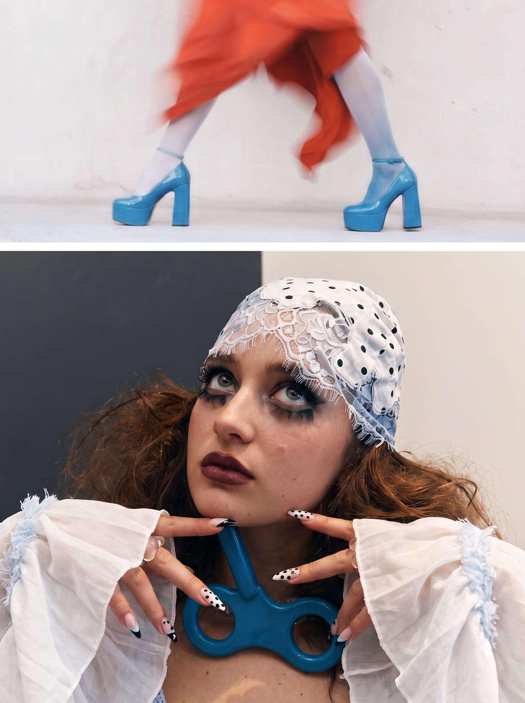 A woman with red curly hair, wearing a lace head wrap and dramatic makeup, poses with her hands framing a blue object against a white and dark background.