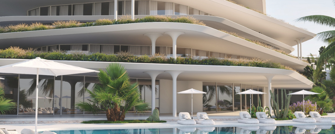 Luxury modern hotel with a pool, outdoor loungers, and umbrellas, surrounded by palm trees.