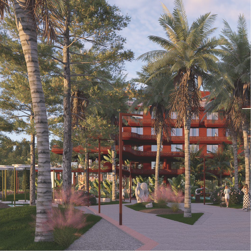 A modern multi-story building with red walls is surrounded by tall palm trees and lush greenery. The scene is set in a landscaped park with walking paths, decorative plants, and benches, with people strolling and enjoying the area, under a partly clo