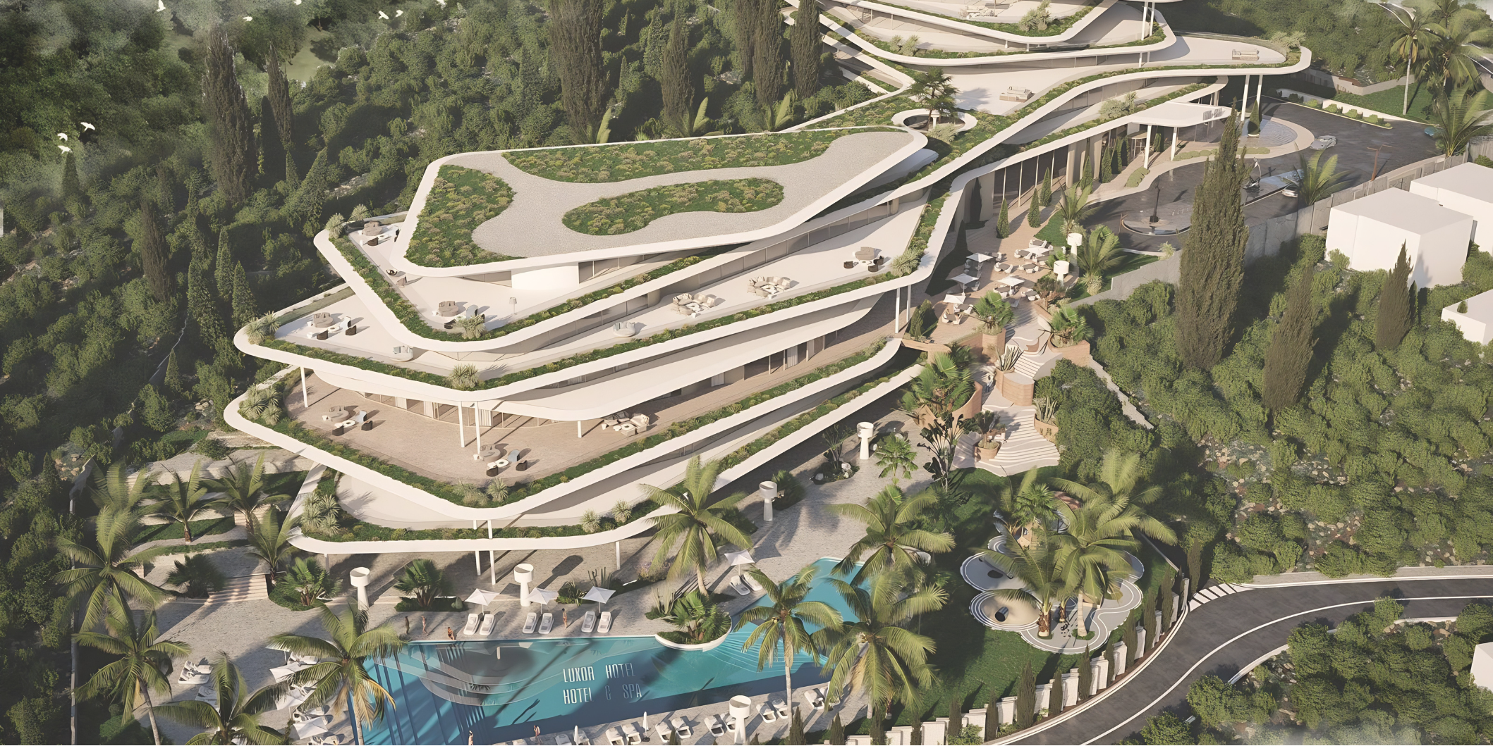 Aerial view of a modern multi-story luxury hotel and spa with white curving terraces, surrounded by lush green trees, palm trees, and a swimming pool with lounge chairs.
