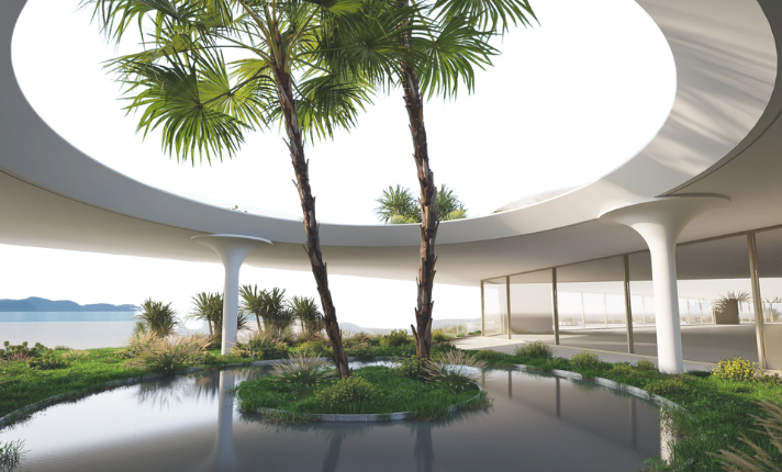 Modern indoor space with large circular skylight, two palm trees, a water feature, and floor-to-ceiling windows overlooking a coastline.