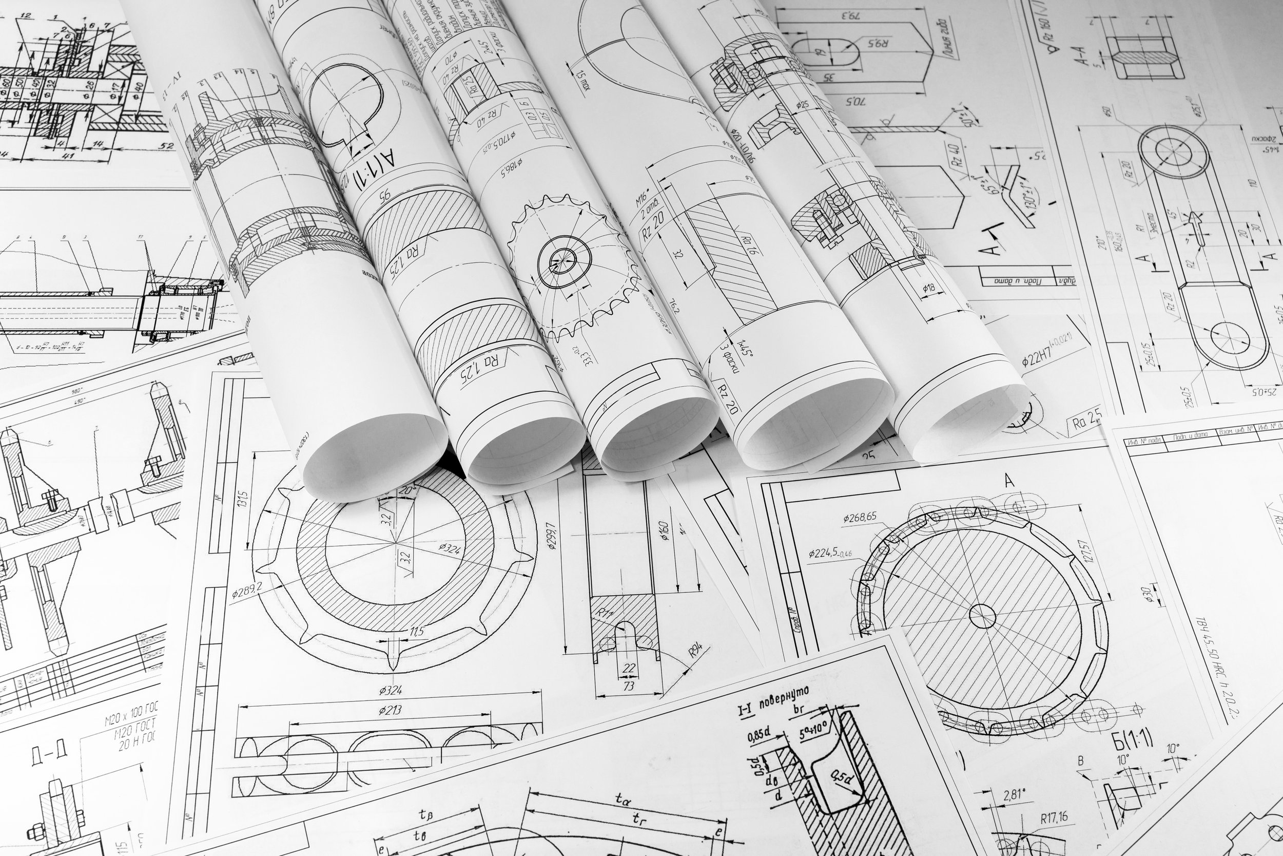 A collection of detailed mechanical engineering blueprints and technical drawings, including various mechanical parts and components.