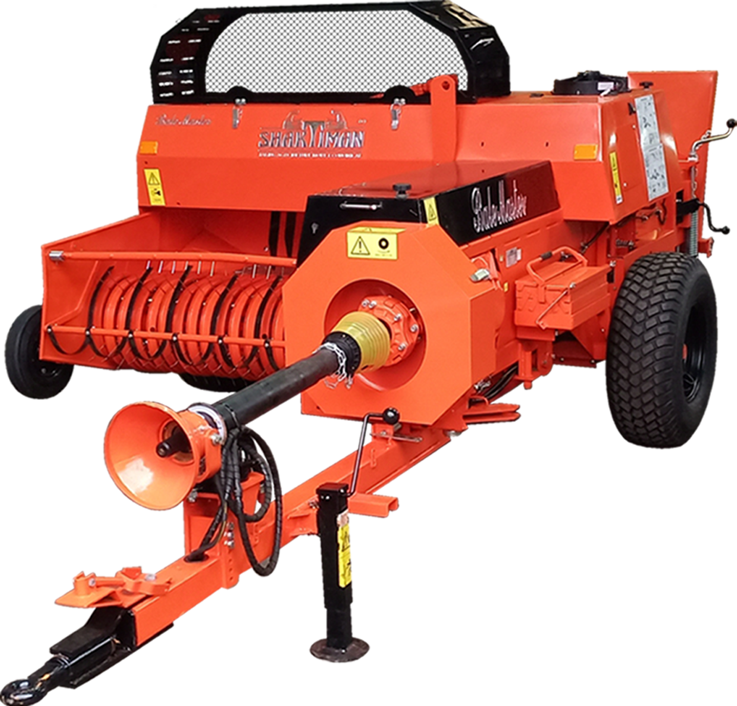 Orange agricultural or industrial equipment with large black tires, featuring a rotating drum and hydraulic components, branded 'Shark TI MAN'.
