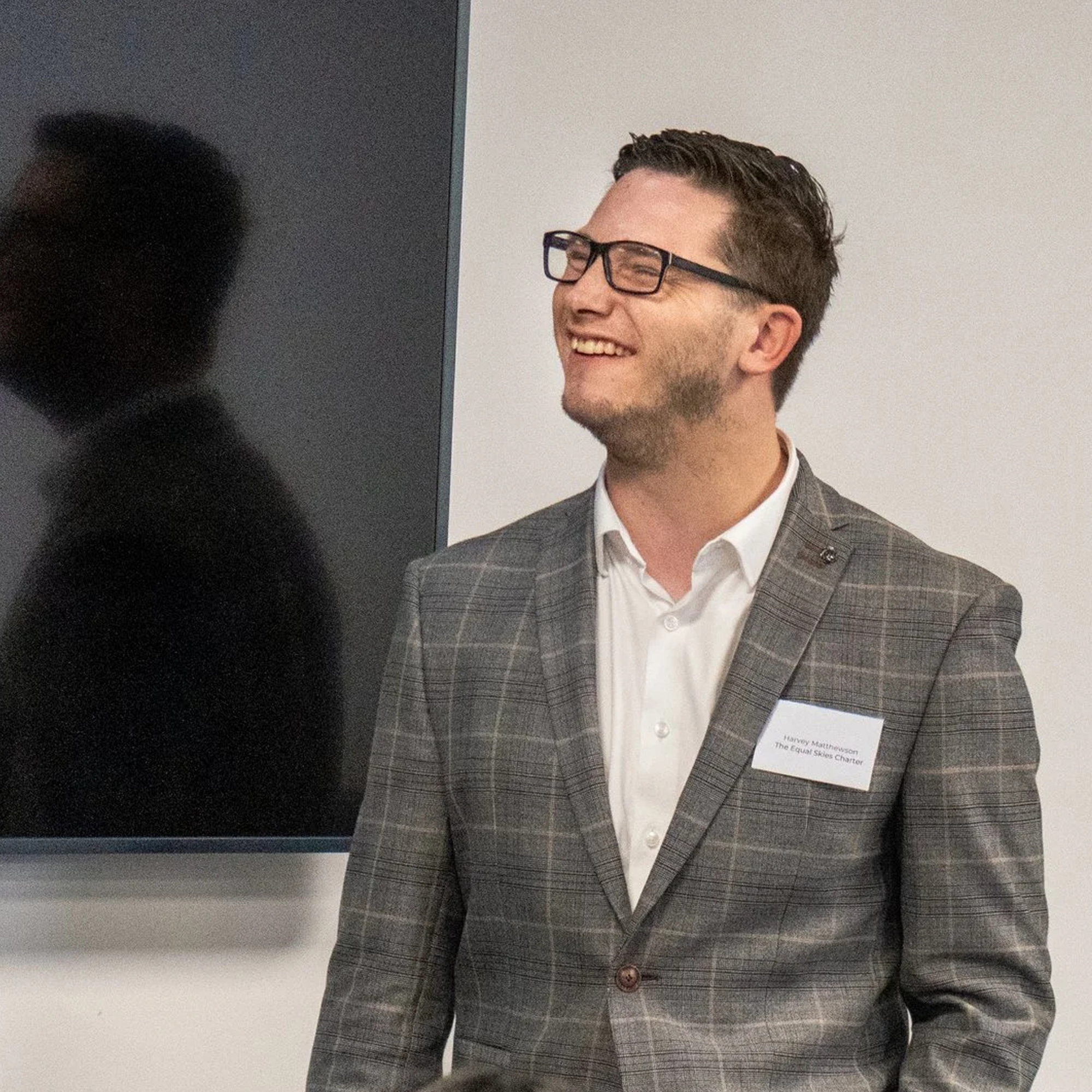 Photo of Harvey speaking at an event.