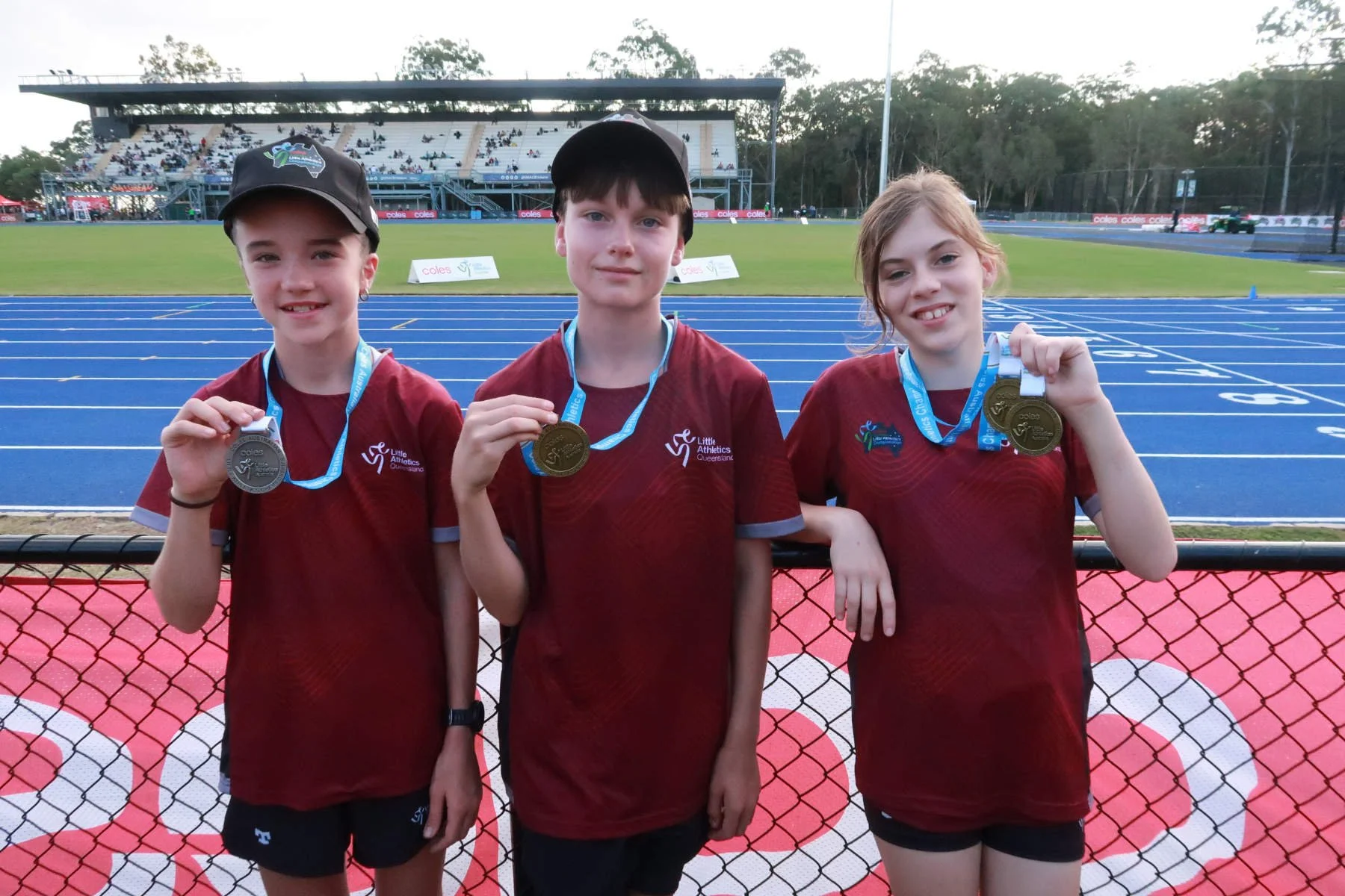 Ormeau Little Athletics athletes at ALAC nationals with their medals