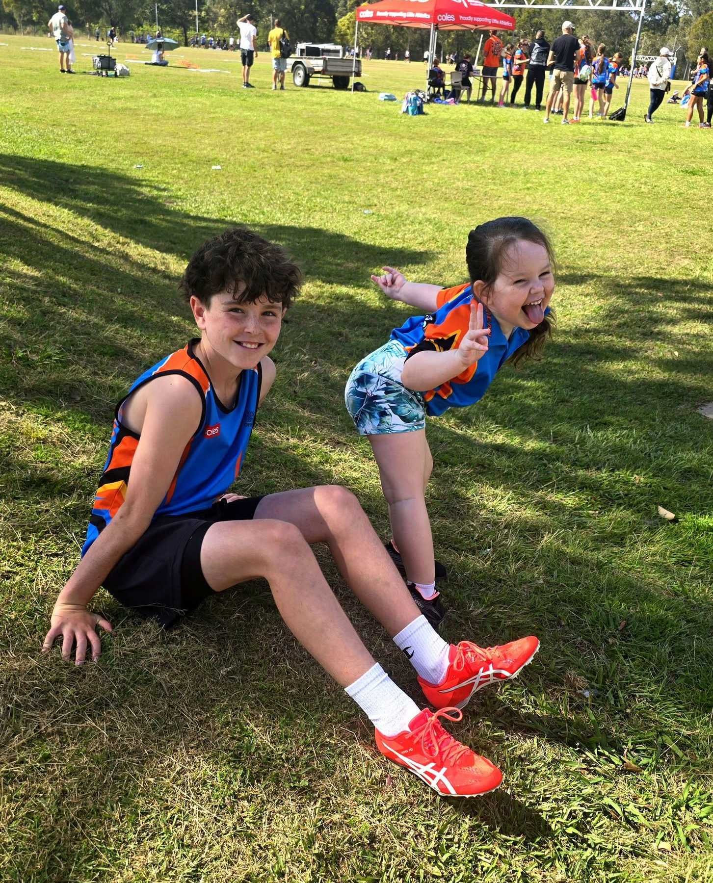 Two Ormeau Little Athletics athletes being silly and having fun at one of our competition days
