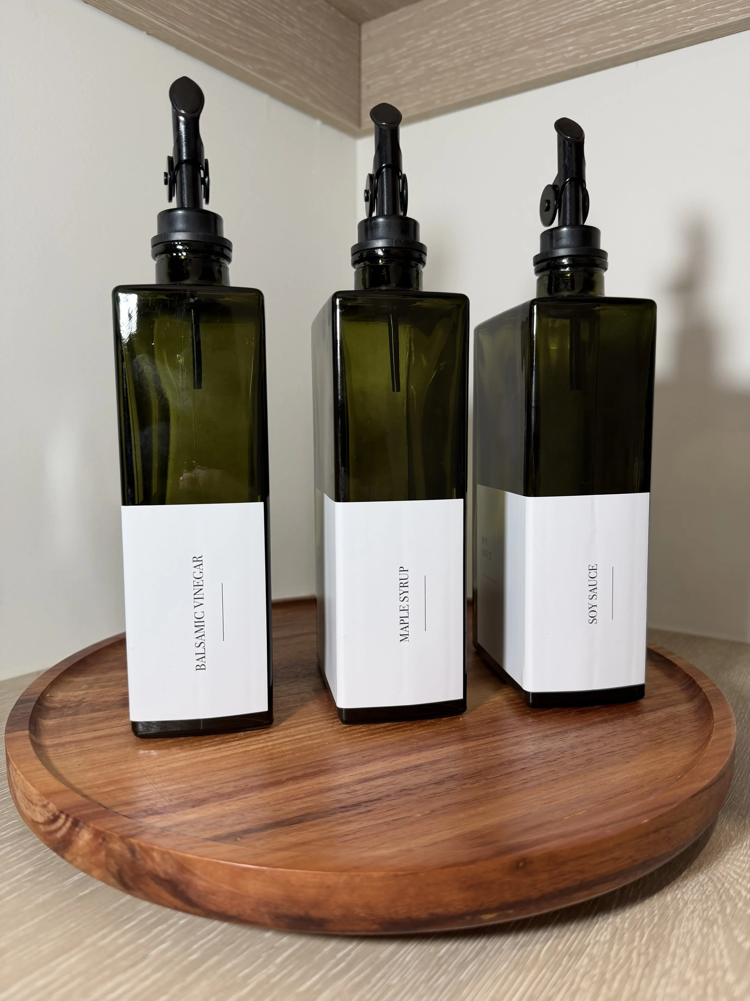 Decanted pantry bottles labelled and displayed in the Spring Creek Residence kitchen