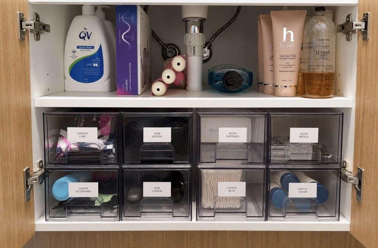 Ensuite cupboard with labelled drawers for personal care storage