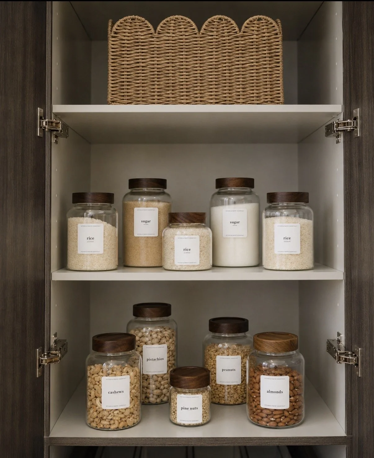 Walk-in pantry with labelled clear canisters on timber shelving