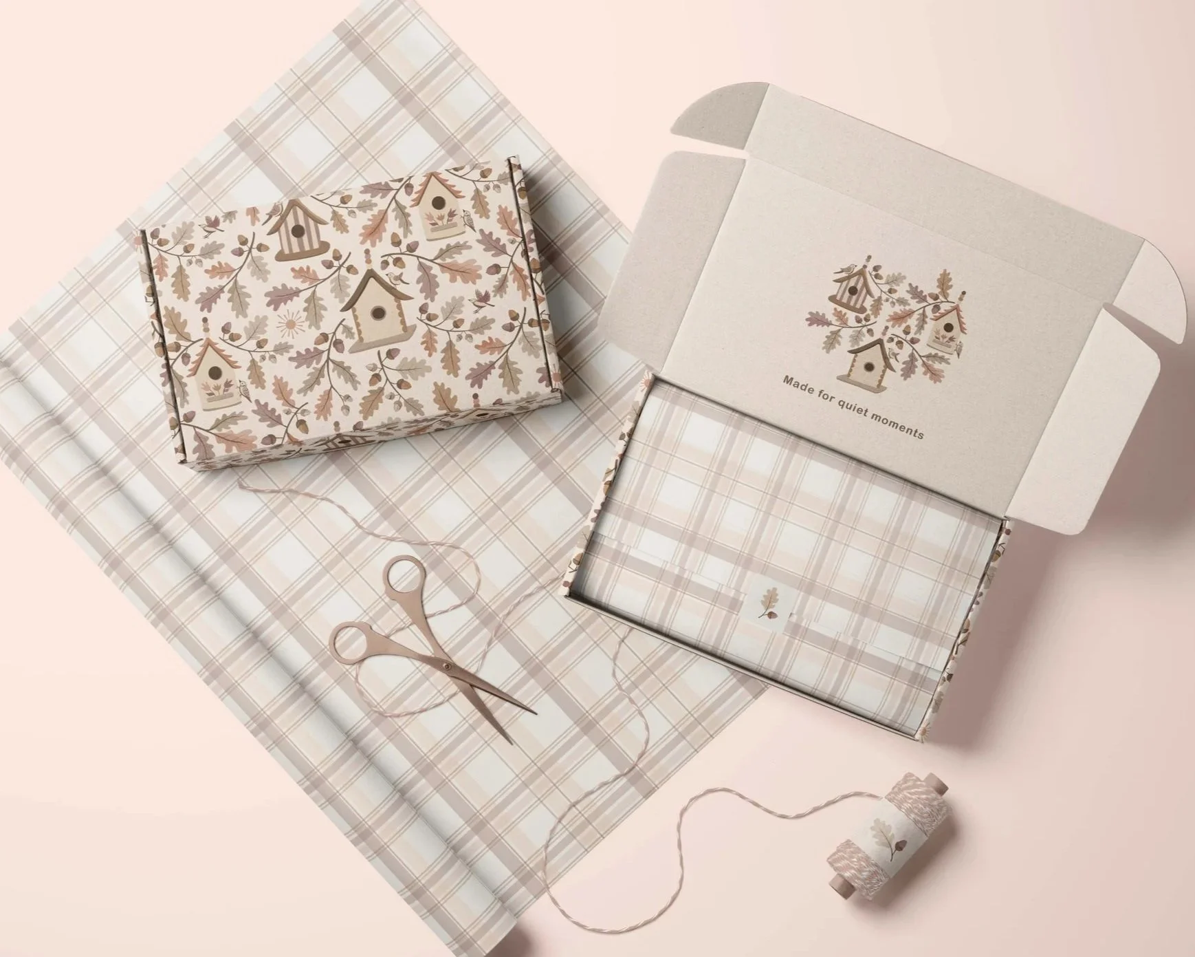 Under the Oaks surface pattern collection by Mia Daniela Design applied to coordinated gift packaging with birdhouse, woodland and plaid motifs.