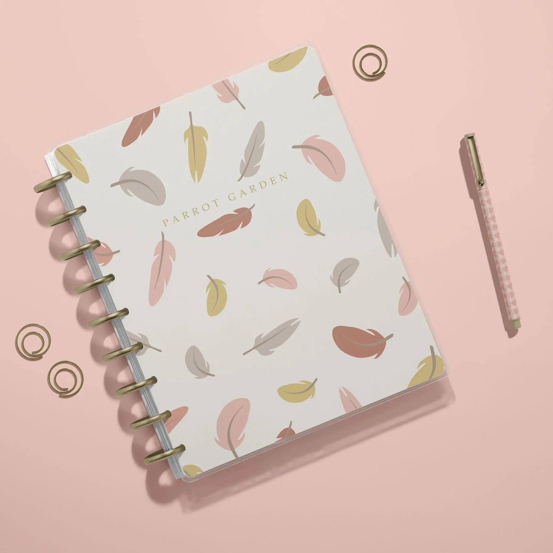 Notebook mockup featuring the Parrot Garden Soft Sand colorway with coordinating botanical surface pattern designs.