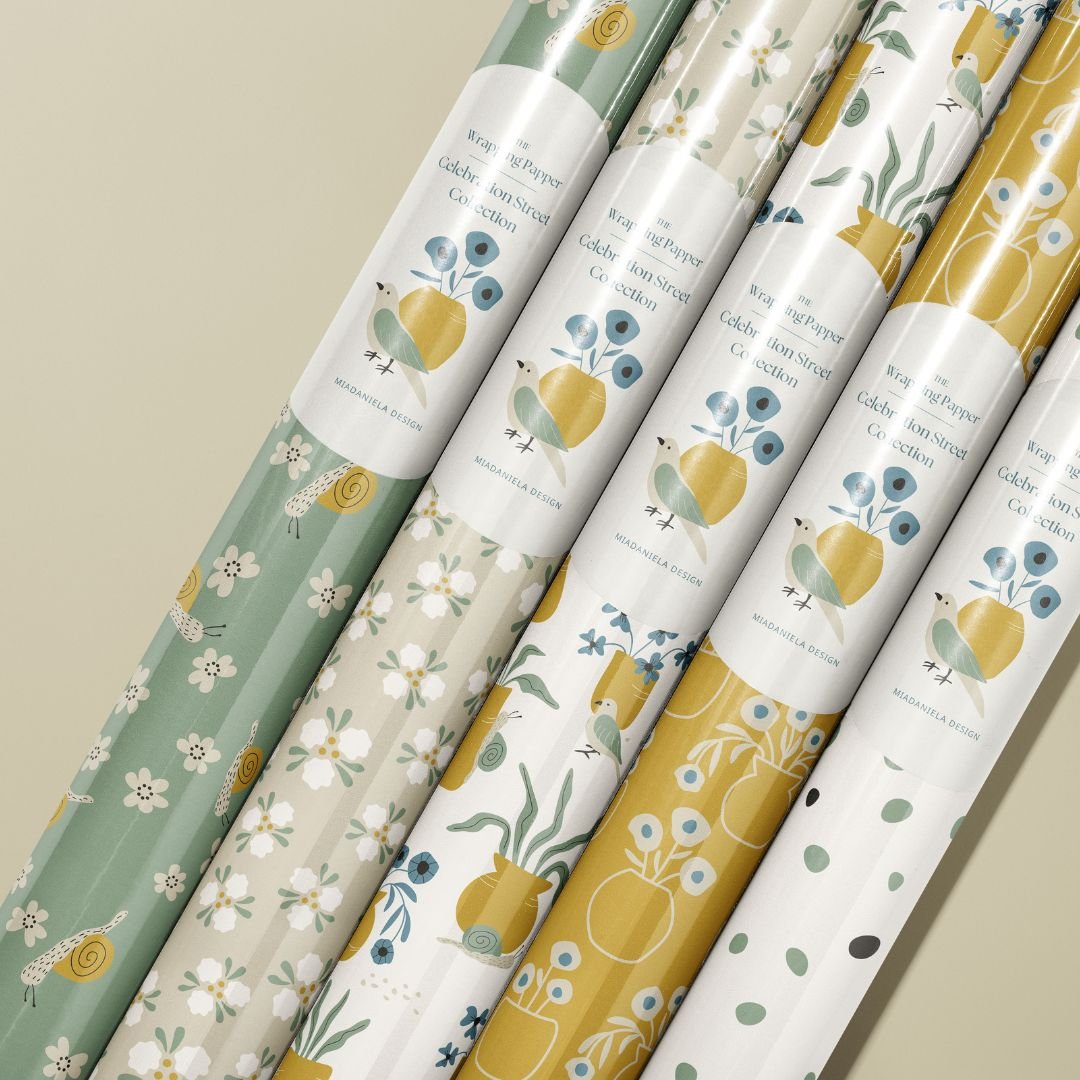 Wrapping paper collection featuring coordinated Garden Poetry floral surface patterns designed for gift wrap and boutique packaging.
