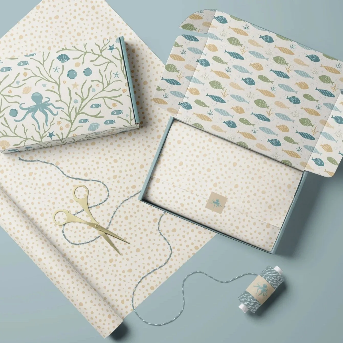 Premium packaging mockup featuring the Coastal Coral Reef collection applied across gift boxes and wrapping paper.