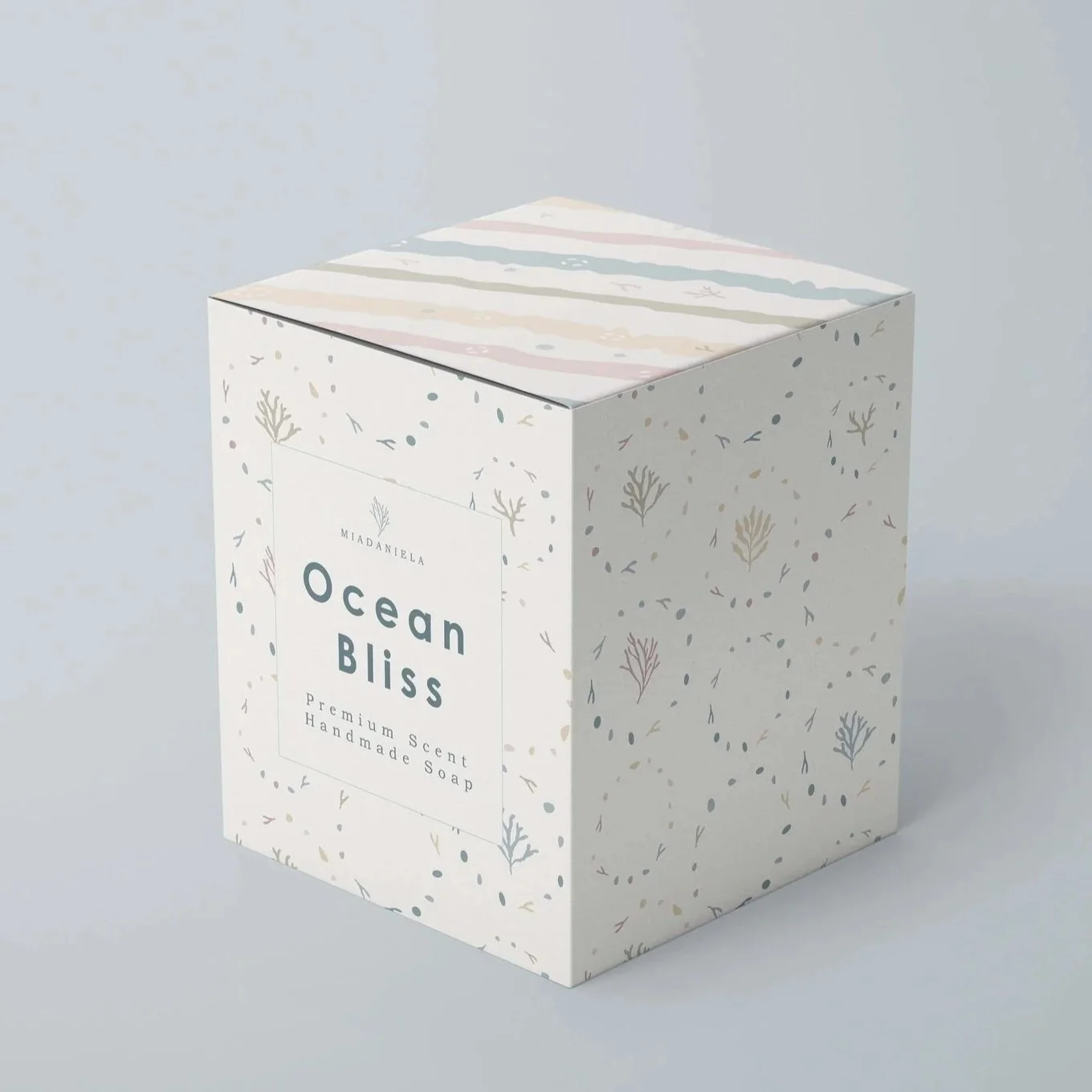 Boutique candle packaging mockup featuring coordinated coastal botanical surface patterns.