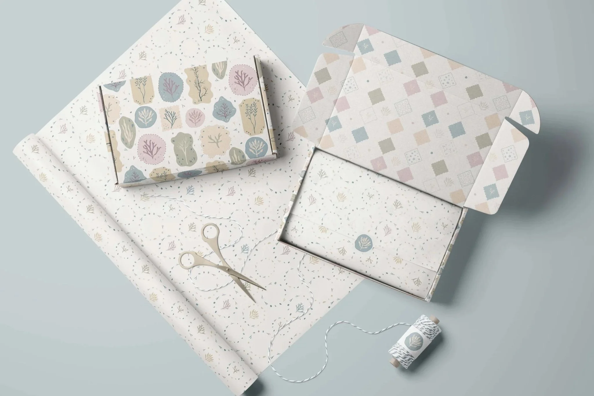Packaging mockups featuring the Collected Sea Botanicals surface pattern collection, including coordinated botanical patterns designed for gift boxes, stationery and paper goods.