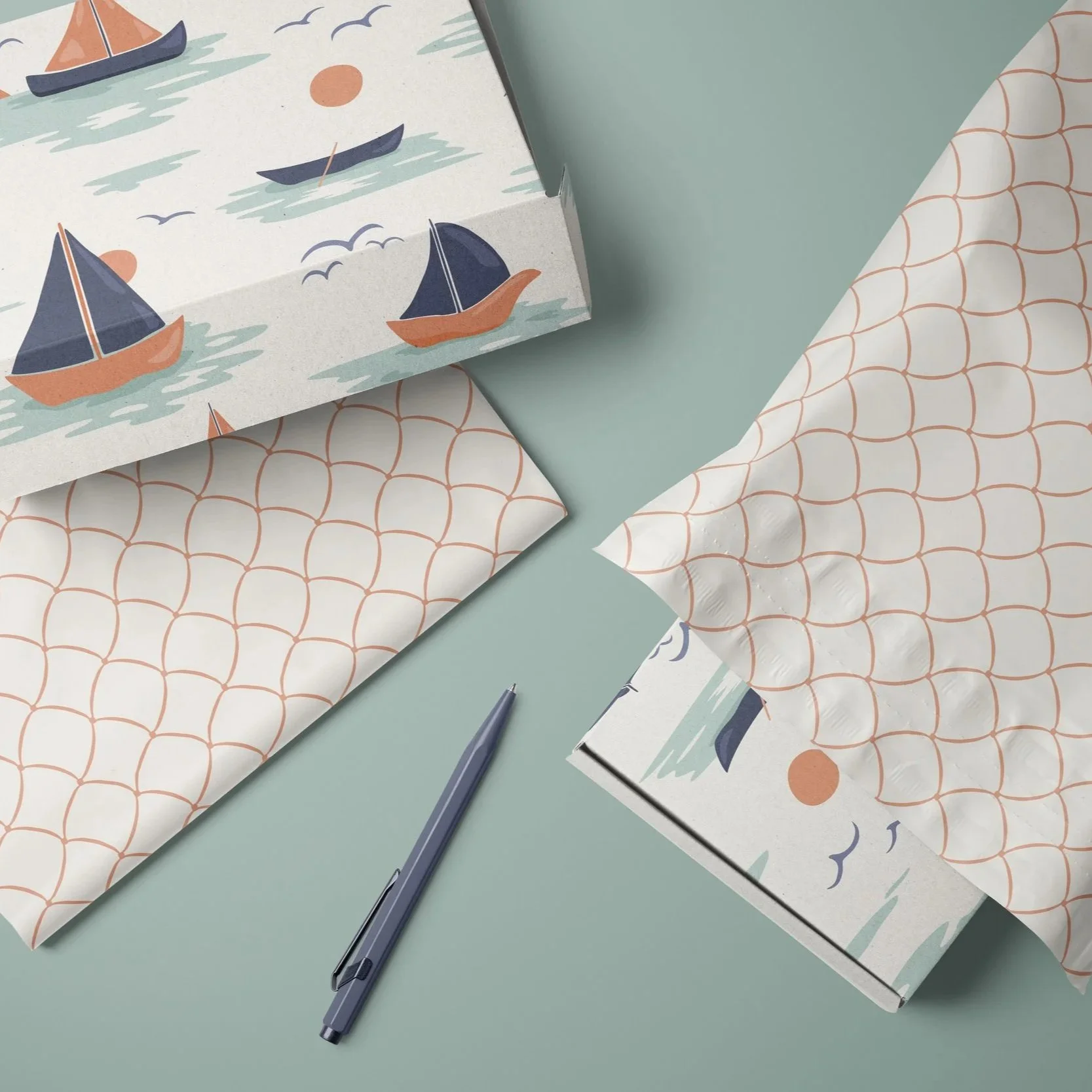Stationery and packaging mockup featuring coordinated nautical surface pattern designs from the Dusk Sailing collection.