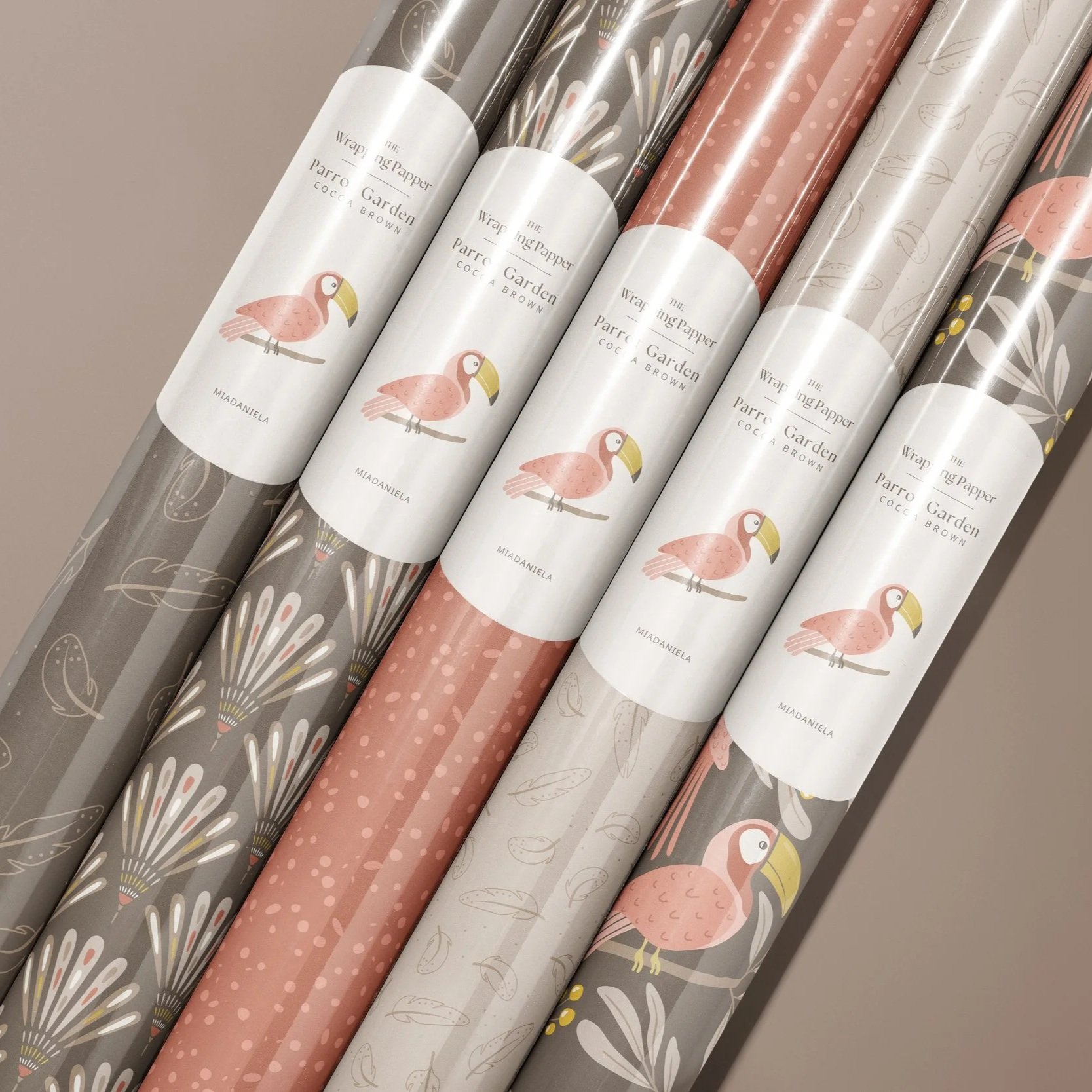 Wrapping paper collection featuring coordinated botanical surface pattern designs from the Parrot Garden collection in the Cocoa Brown colorway.
