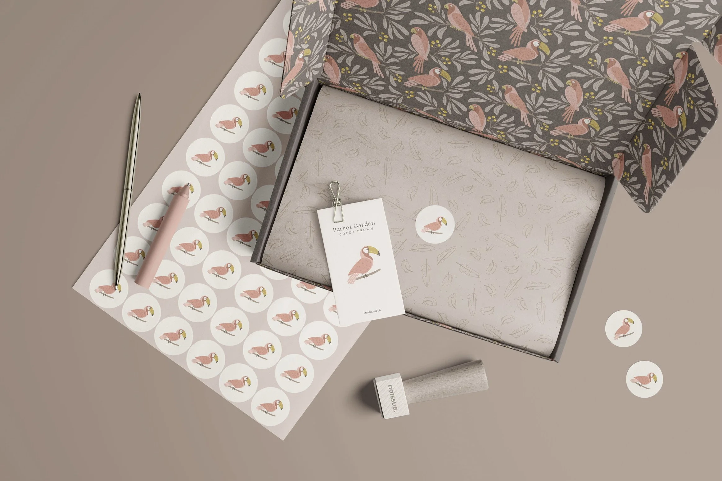 Parrot Garden surface pattern collection applied to premium gift packaging and stationery products.