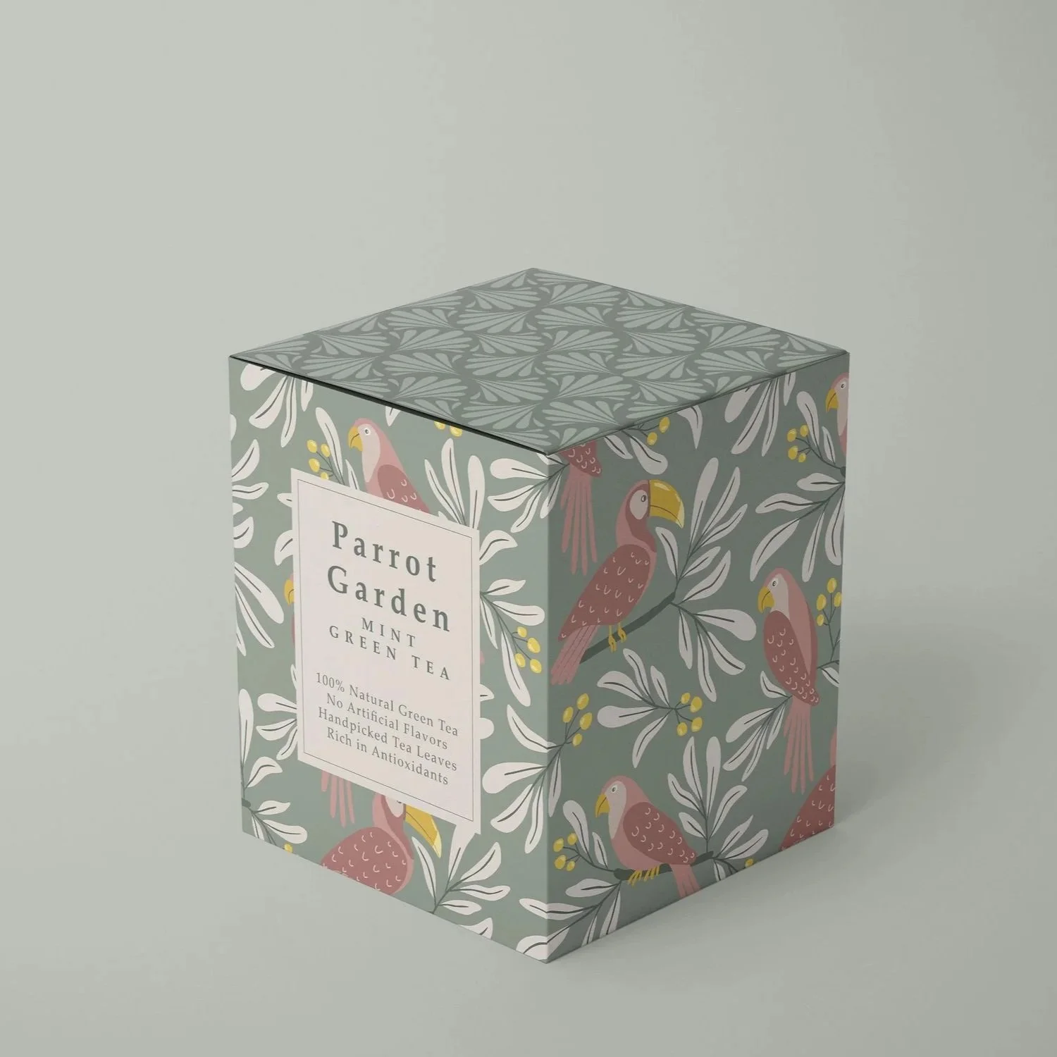 Premium tea packaging featuring coordinated botanical surface pattern designs from the Parrot Garden Moss Green colorway.