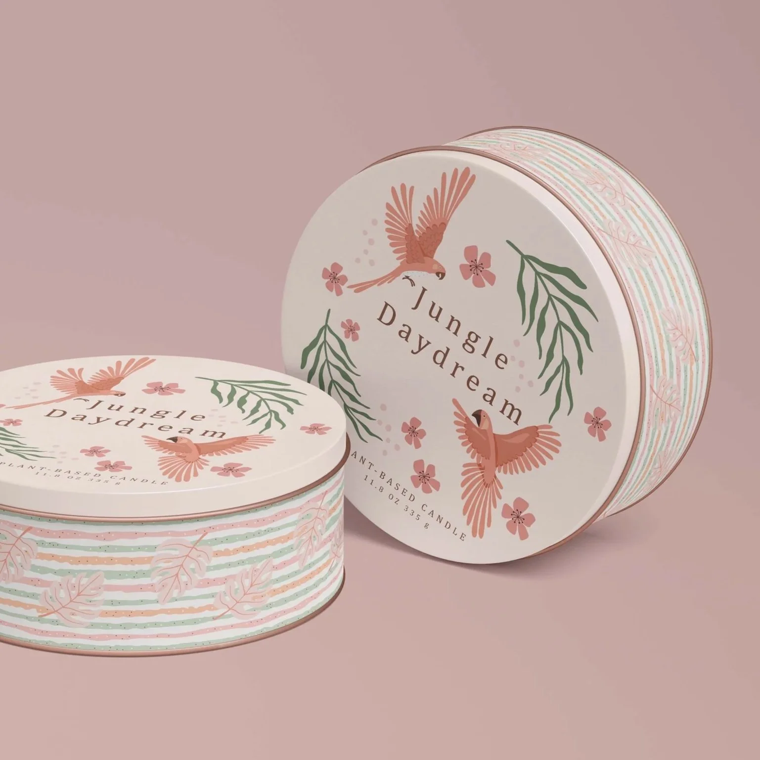 Jungle Daydream tropical bird artwork applied to decorative round metal tins