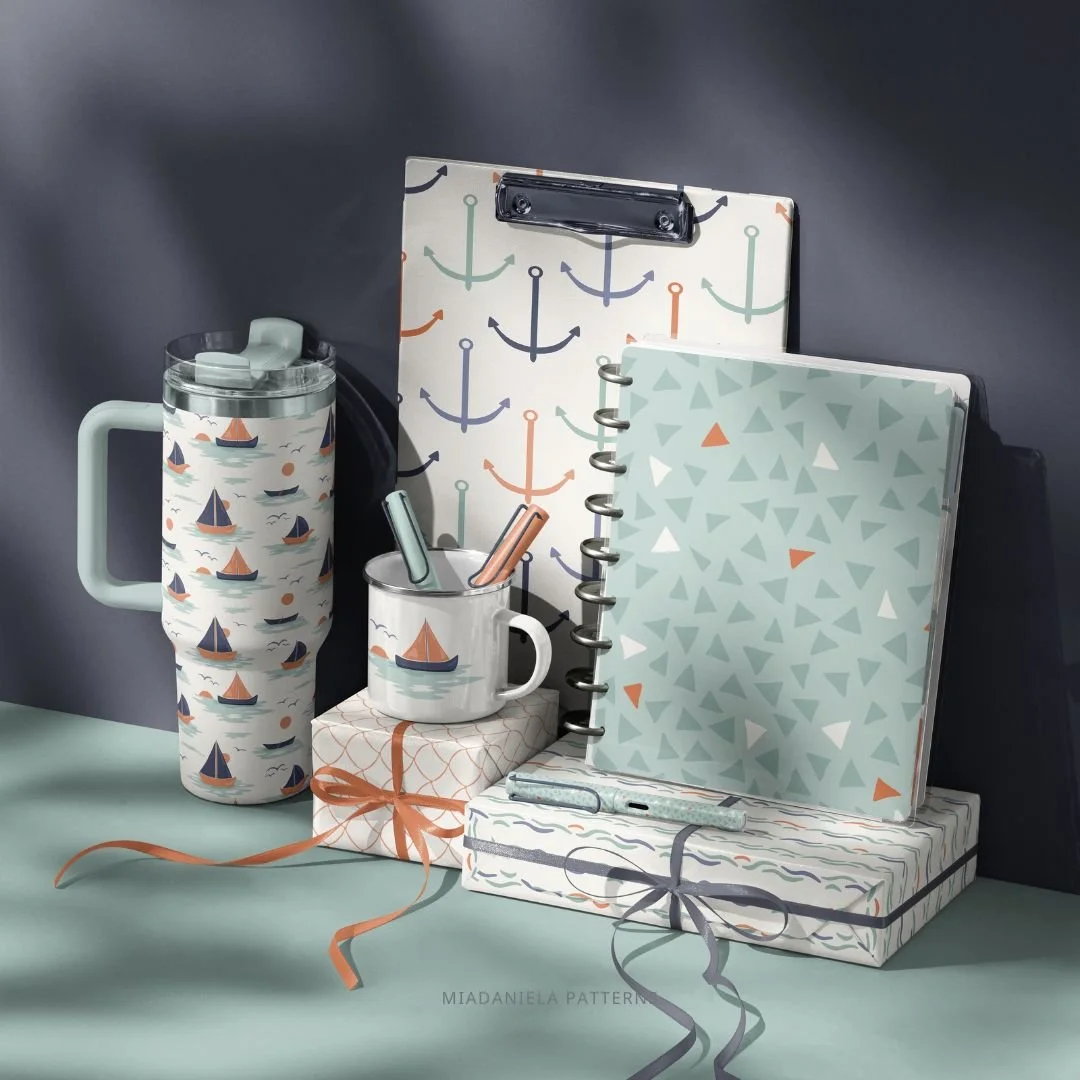 Stationery collection with notebooks, mugs and paper products featuring coordinating nautical pattern designs.