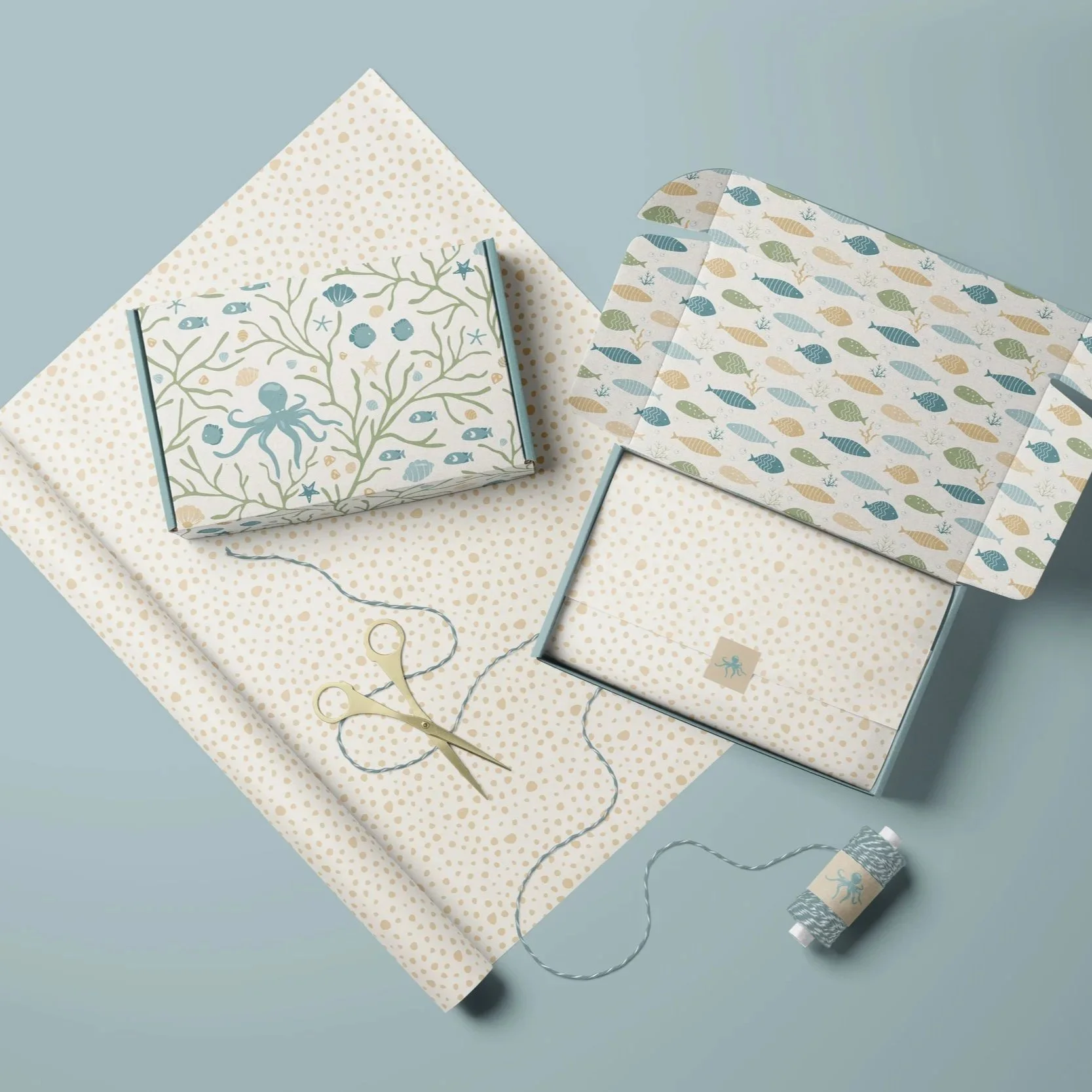 Premium packaging mockup featuring the Coastal Coral Reef collection in the Seafoam Calm colorway applied to gift boxes and coordinated paper goods.