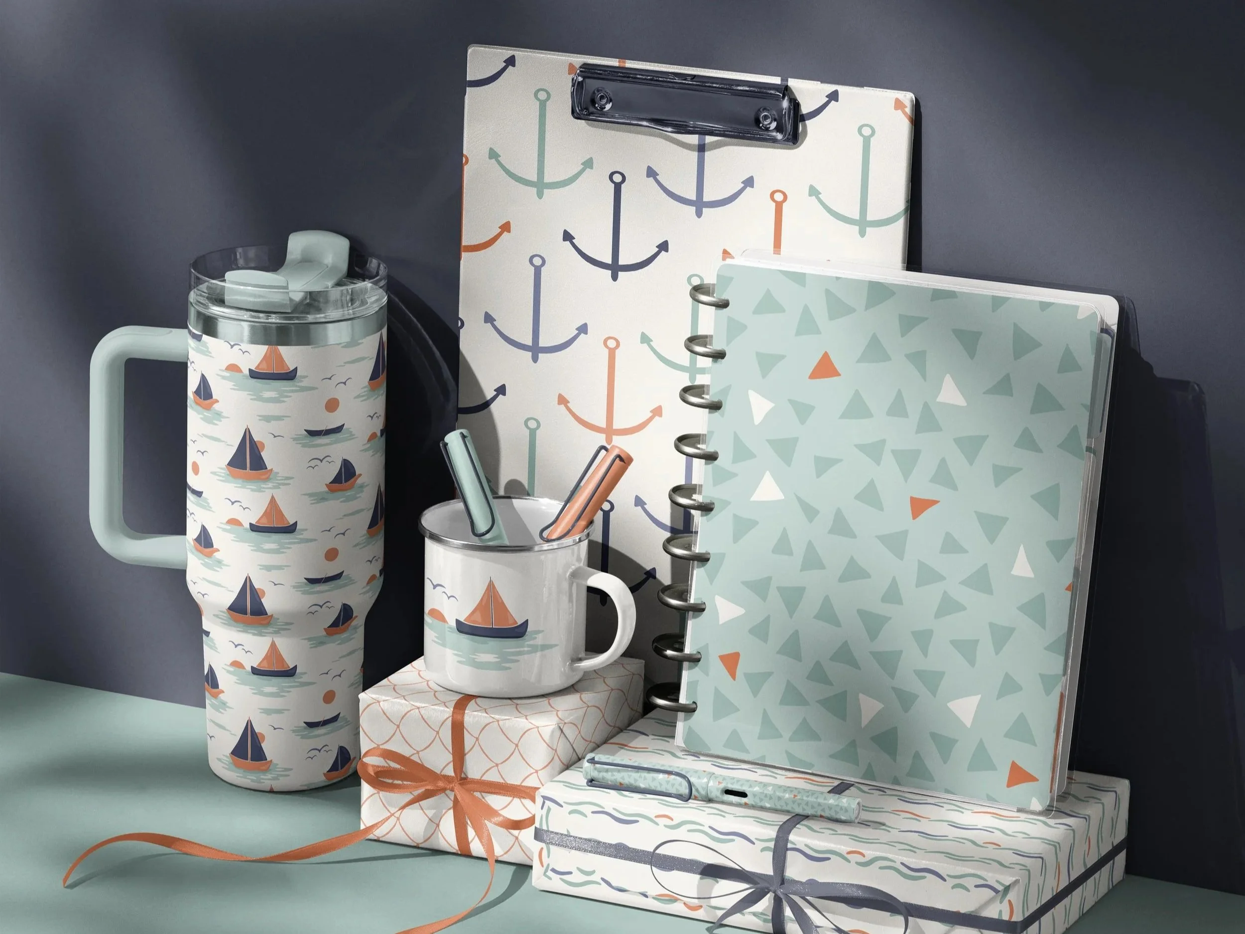Surface pattern licensing portfolio showcasing coordinated nautical artwork applied across drinkware, stationery and lifestyle products.