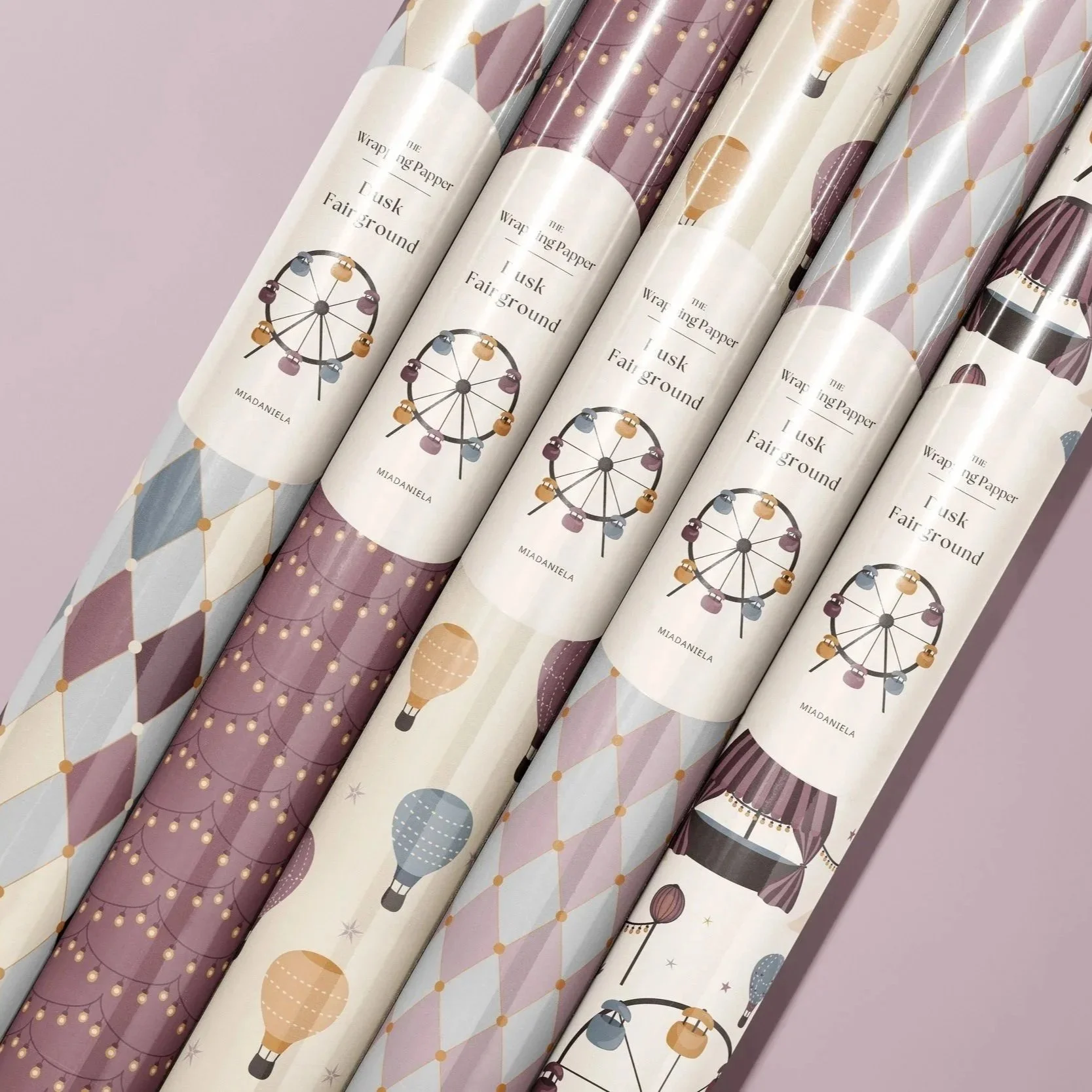 Wrapping paper mockup showcasing coordinating surface pattern designs from the Dusk Fairground collection.