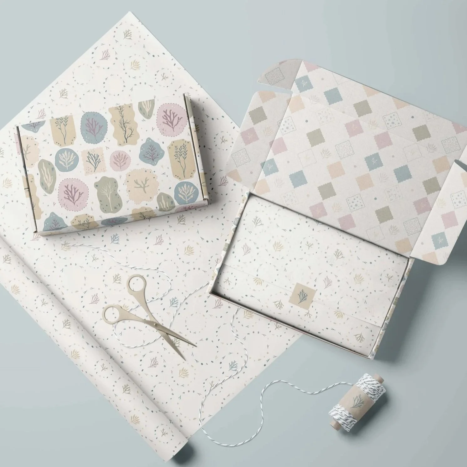 Paper goods collection mockup featuring wrapping paper, envelopes and coordinated packaging designs.