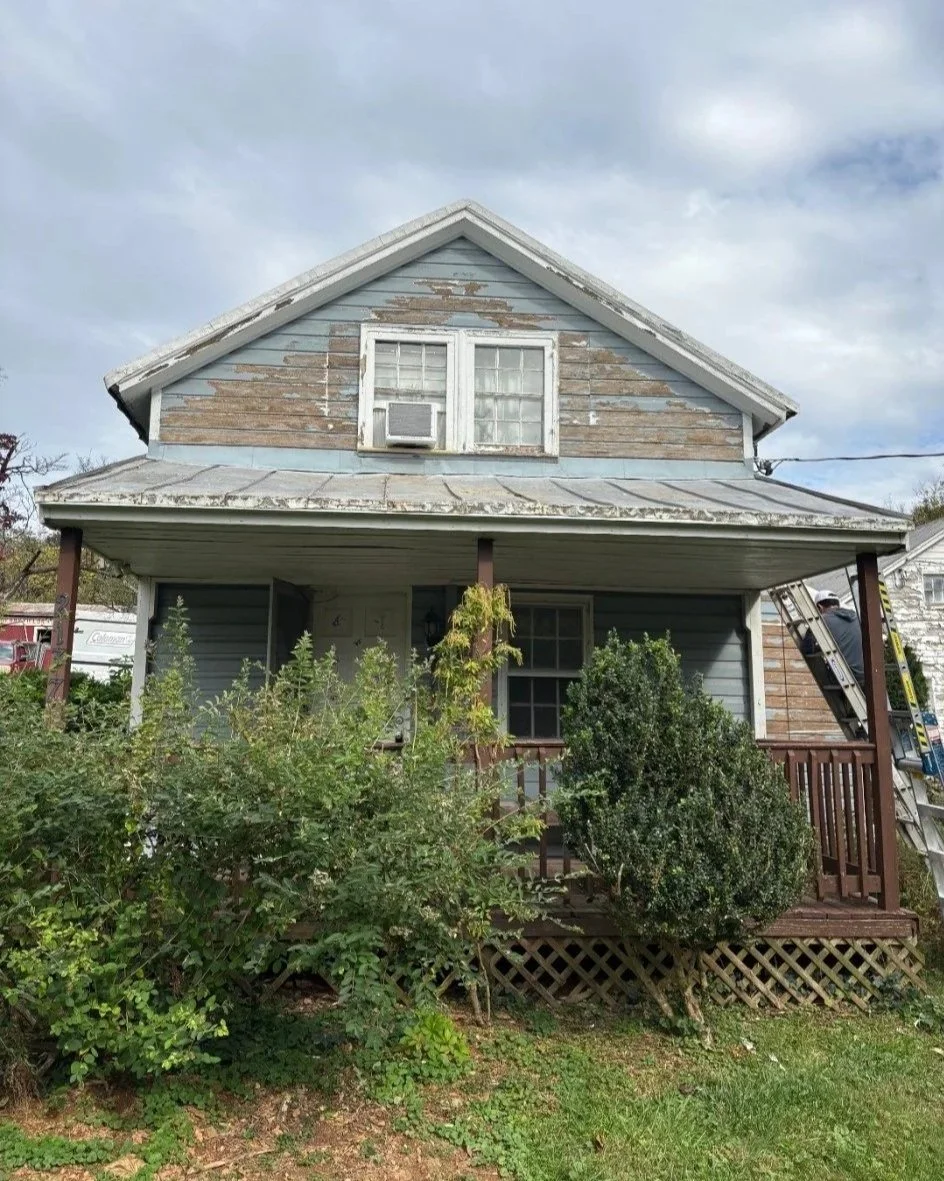Before: worn paint and exposed wood on the front gable, with weathered trim and porch finishes.
