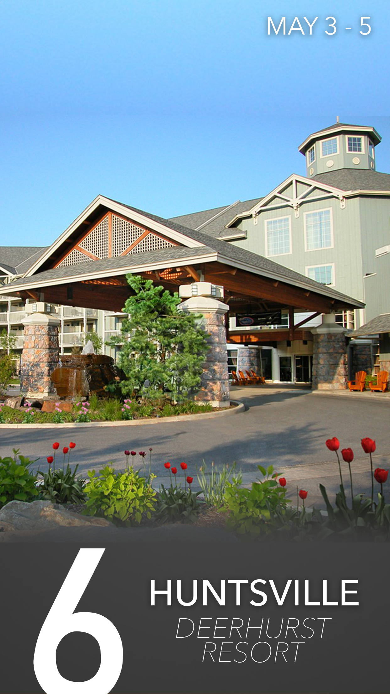 Exterior front view of the Huntville Deerhurst Resort with a stone entrance, wooden roofing, and landscaped garden with flowers under a clear blue sky.