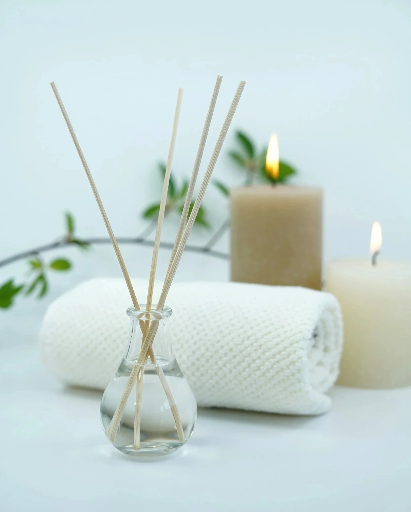 Reed diffuser, candles, and rolled towel — relaxing spa ambiance at Beautiful Me & You esthetics and wellness, Phoenix AZ