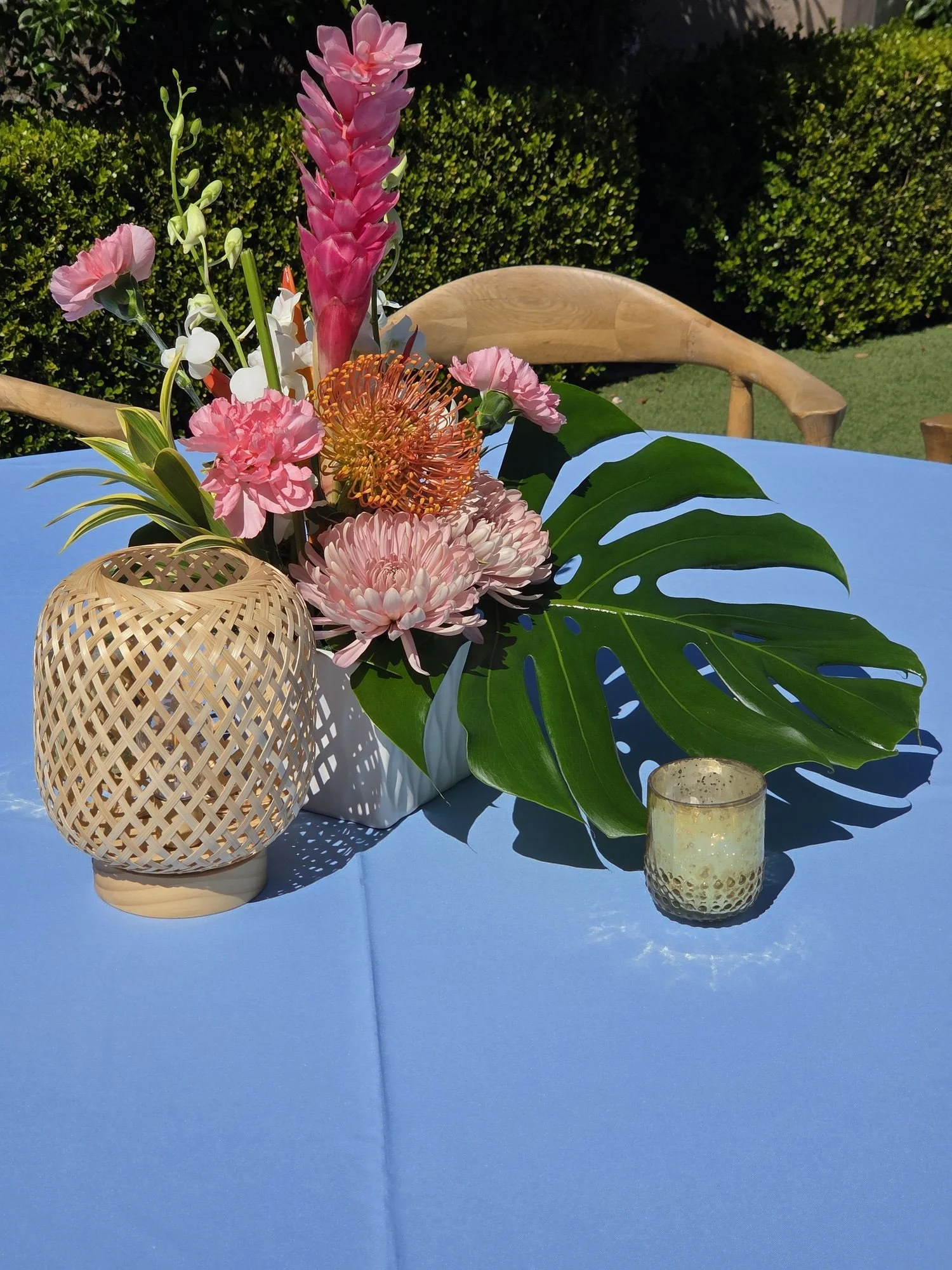 Tropical outdoor floral arrangement centerpiece