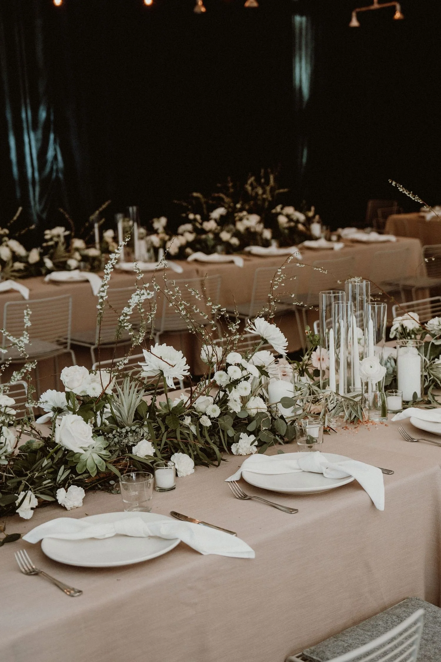 wedding-arrangement-white-roses-greenery-reception.jpg
