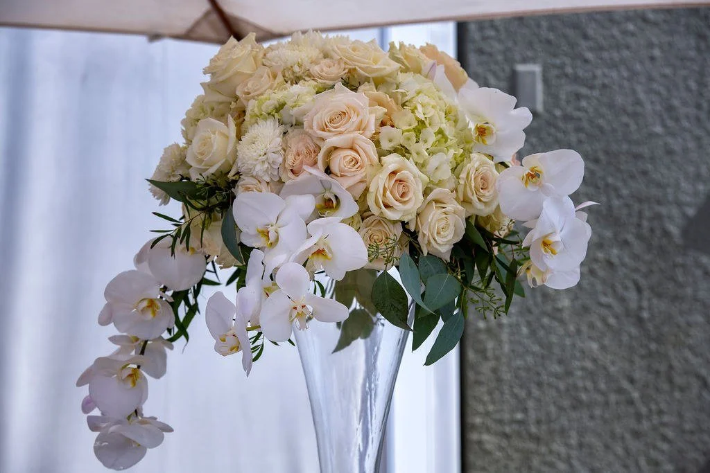 wedding-reception-centerpiece-roses-orchids-crystal-vase.jpg