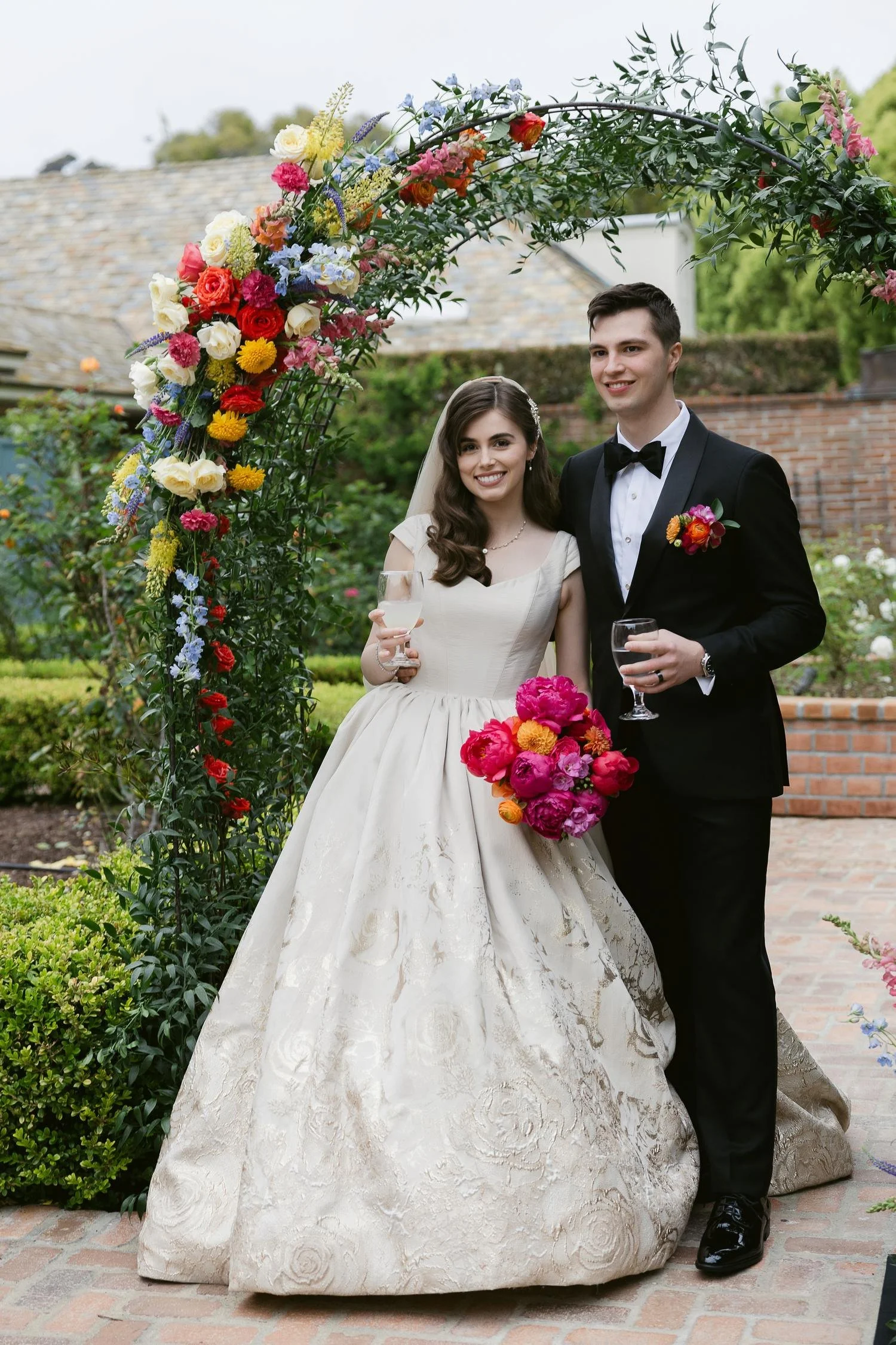 wedding-couple-colorful-floral-arch-san-diego.jpg