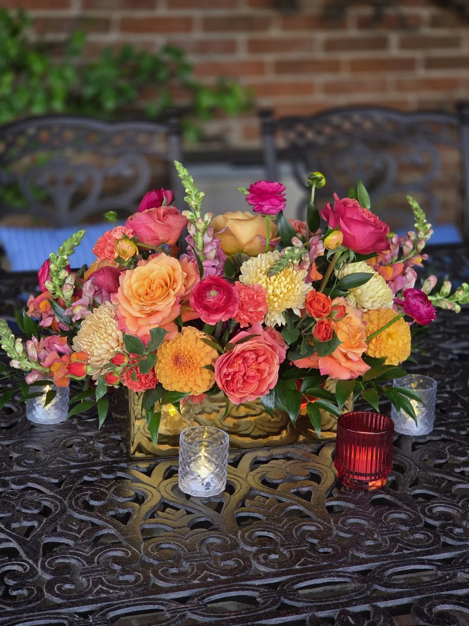 colorful-wedding-floral-gate-arrangement-pink-orange.jpg