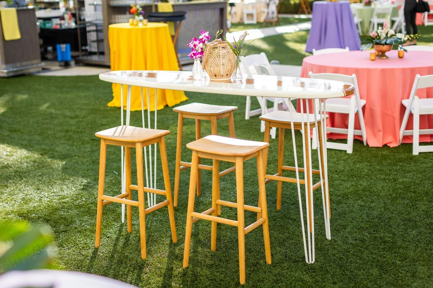Tropical floral centerpiece at outdoor cocktail table