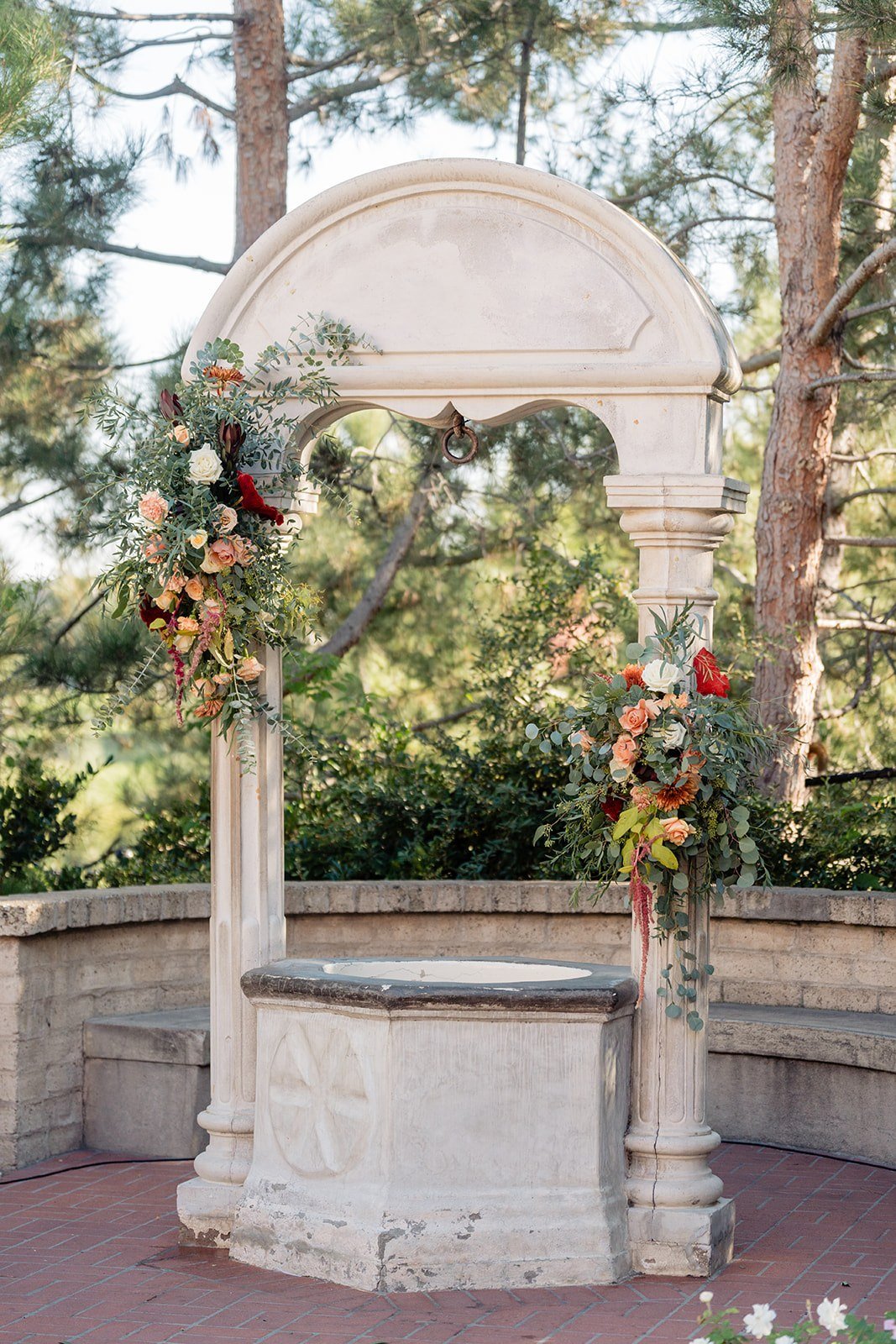 san-diego-wedding-ceremony-stone-arch-florals.jpg