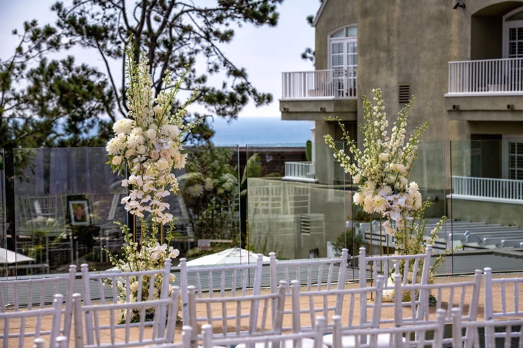 wedding-ceremony-floral-columns-outdoor-ocean-view.jpg