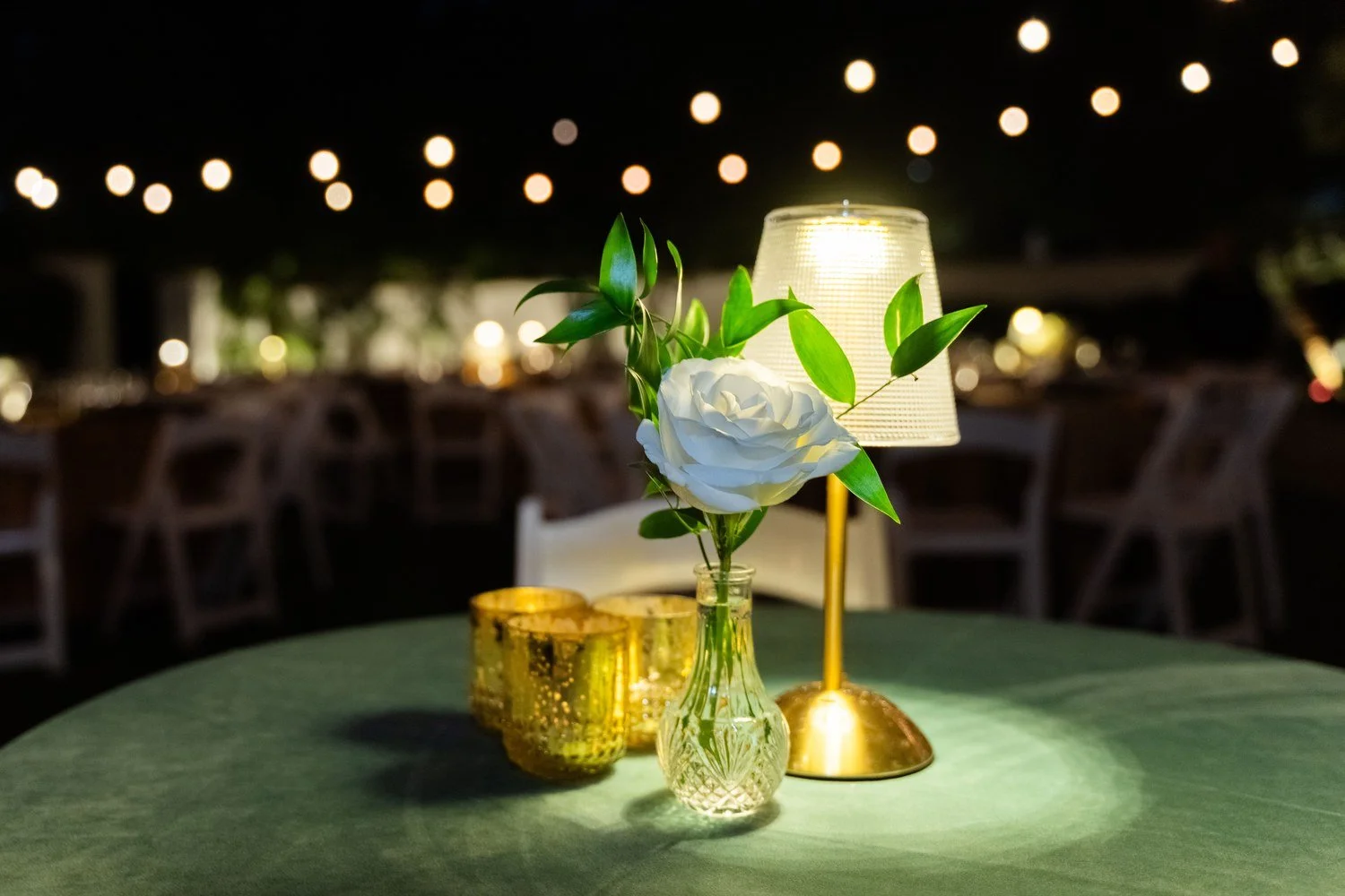 corporate-event-florist-white-rose-bud-vase-string-lights.jpg