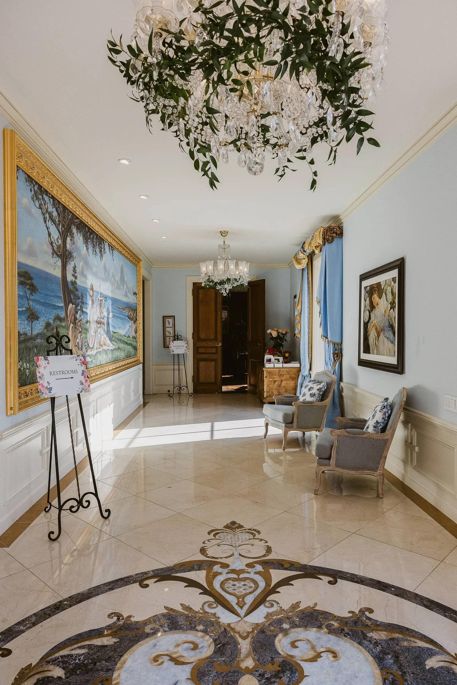 san-diego-wedding-venue-foyer-floral-chandelier-greenery.jpg