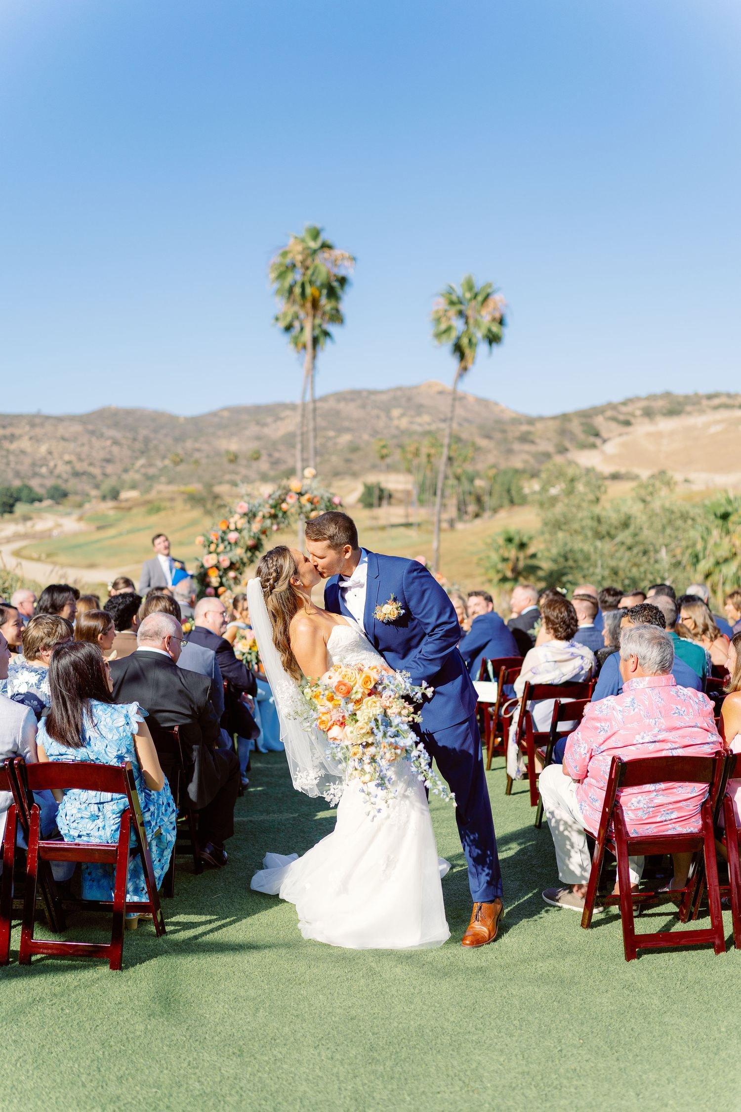 wedding-flowers-san-diego-safari-park-ceremony-kiss.jpg