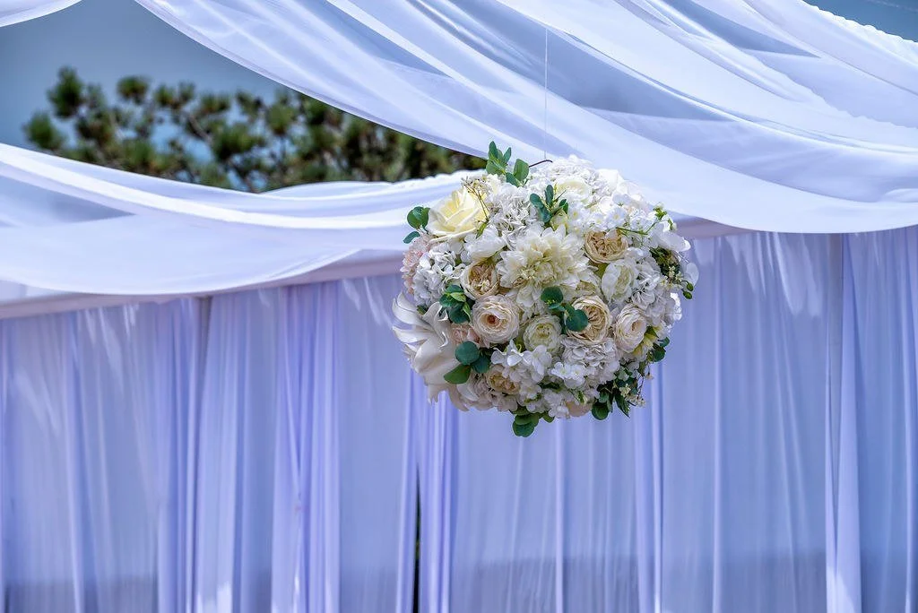 wedding-floral-pomander-ball-white-draped-ceremony.jpg