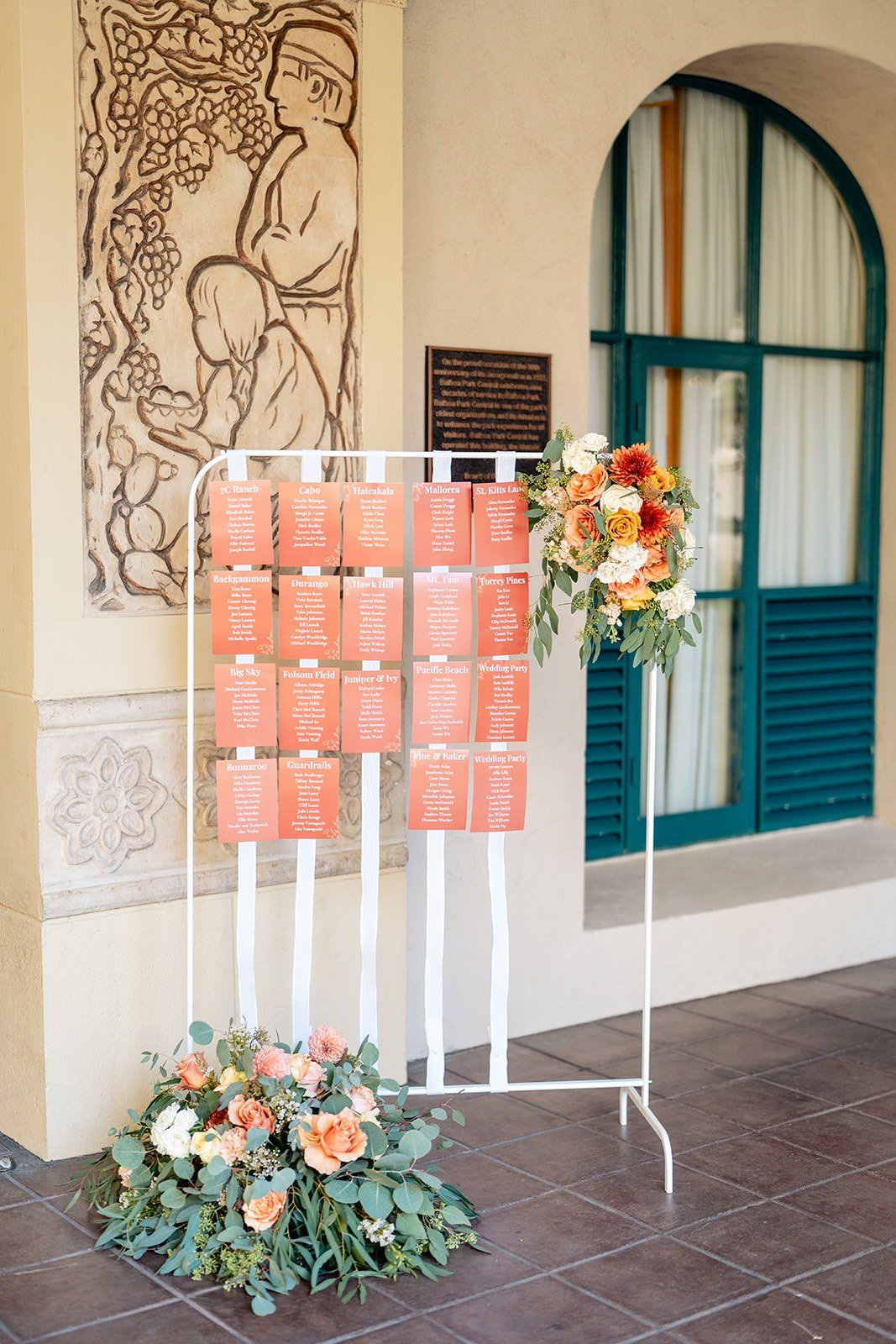 Wedding seating chart with floral sprays