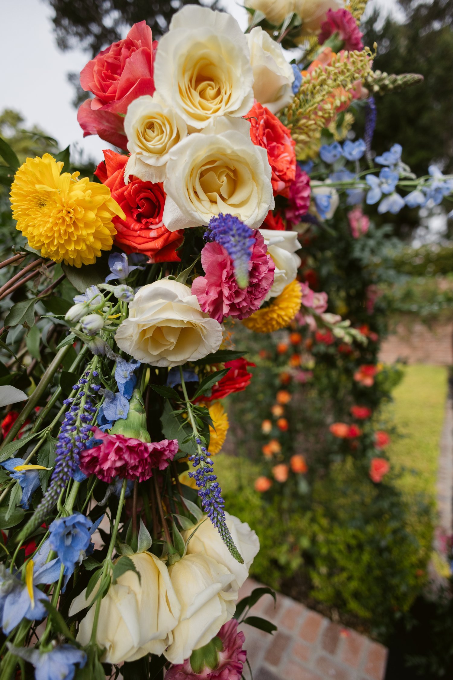 san-diego-wedding-arch-top-cream-roses-delphiniums.jpg