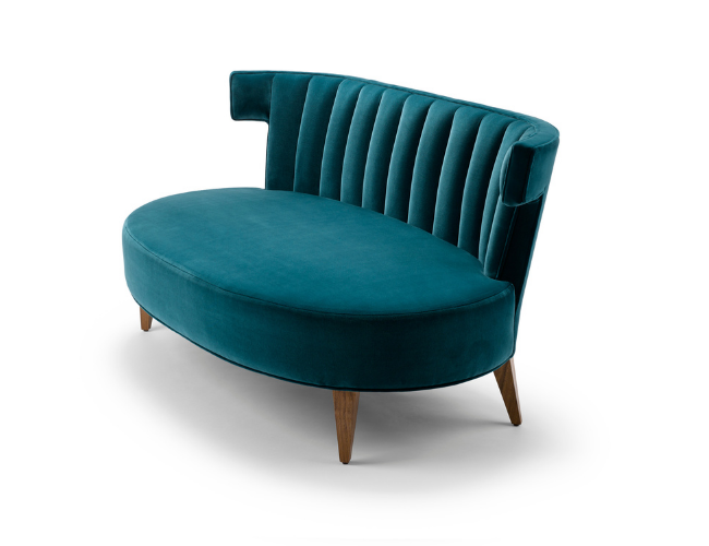 A teal velvet loveseat with a curved backrest and wooden legs.