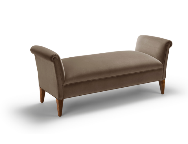A brown upholstered bench with rolled arms and wooden legs on a white background.