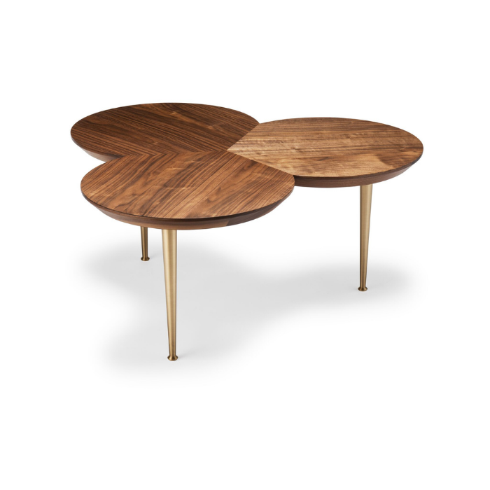 A modern coffee table with three interconnected round wooden tops and gold metal legs.