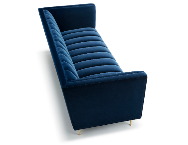 A blue velvet chaise lounge with a cushioned seat and backrest, supported by four small gold-colored legs.